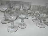 a lot of empty wine glasses sitting on a table