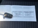 a car key sitting on top of a piece of paper in the back seat of a car