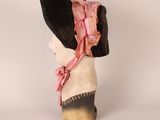 a black hat with a pink ribbon on top of it