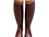 pair of brown leather riding boots on a white background