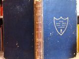a blue book sitting on top of a wooden table