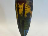 a vase that is sitting on a white surface