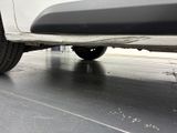 a close up view of a car ' s bumper on the ground