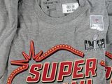 several t - shirts are on display in a store for sale