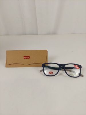glasses are sitting on a table next to a box of glasses