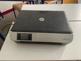 laptop sitting on top of a desk in a classroom