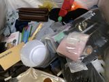 a picture of a trash can filled with various items