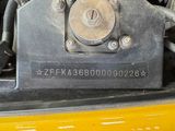 a close up of the engine of a yellow car