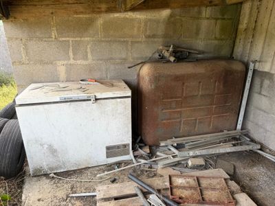 a small refrigerator and a small refrigerator in a room