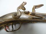 a close up of a gun with a bird on it