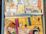 Plusieurs livres pour enfants sont empilés les uns sur les autres dans une boîte