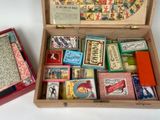 a wooden box filled with different types of playing cards