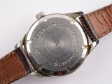 an image of a close up of a watch on a white surface