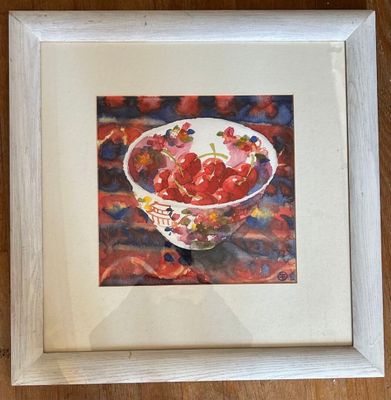 painting of a bowl of strawberries in a white frame on a wooden table