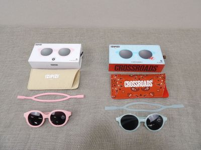 three pairs of sunglasses, a pair of glasses, and a pair of sunglasses