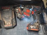 two batteries and a charger in a tool box