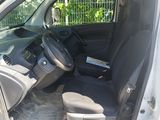 the interior of a car with the door open and the driver ' s seat down