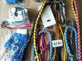 a lot of dog leashes that are on a cardboard box