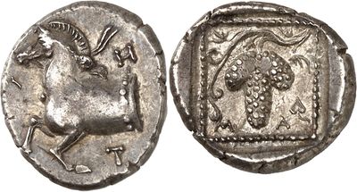 a silver coin with an image of a horse on it