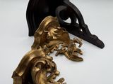 pair of antique bronze figurines of a man and a woman