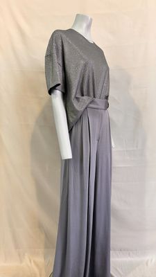 the mannequin is wearing a gray dress with a belt