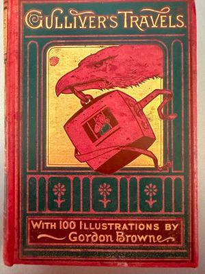 an old book with a picture of a bird on top of a toaster