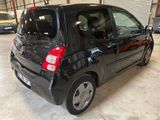 a small black car that is parked in a garage