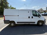 a white van that is parked on the side of the road