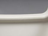 a close up of a white vase on a table