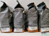 three bags of coffee sitting on top of a table next to each other