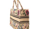 embroidered tote bag with flowers and stripes on a white background