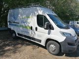 a white van that is parked on the side of the road