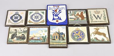 a picture of a group of tiles with a coat of arms on them