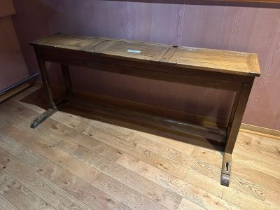 a wooden table that is sitting on a hard wood floor