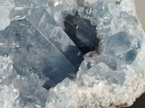 a very large piece of blue crystal on a rock