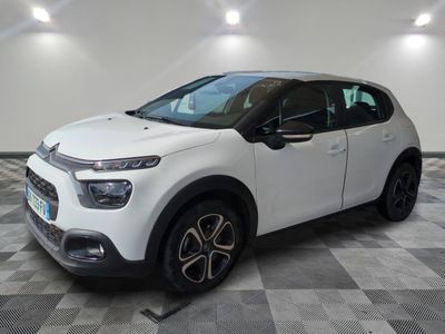 the white citrole is parked on a checkered floor