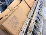 many boxes stacked on top of each other in a warehouse