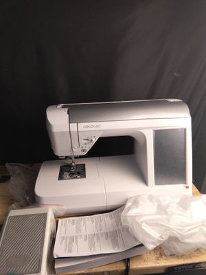 a sewing machine sitting on top of a wooden table