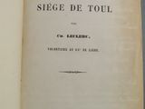 an open book with a black and white image of the title on it