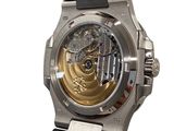 a close up of a watch on a white background