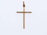 a gold cross on a white background