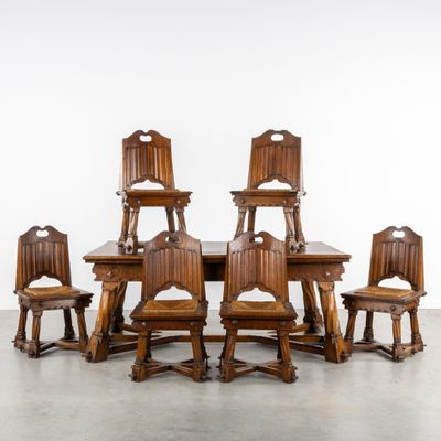 an image of a group of wooden chairs sitting on top of a wooden table