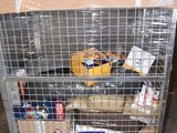 a metal cart with a bunch of items inside of it