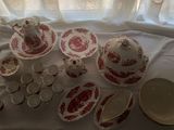 a table with a lot of dishes and cups on it