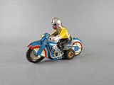 a figurine of a man riding a motorcycle