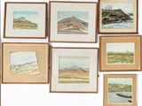 a lot of paintings on the wall of a room