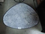 a table that has a triangle shaped table top on top of it