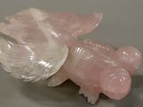 a figurine of a pig with wings on a table
