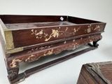 a wooden box with a floral design on it and a wooden box with a flower design on it
