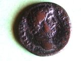 a brown coin with a picture of a man on it